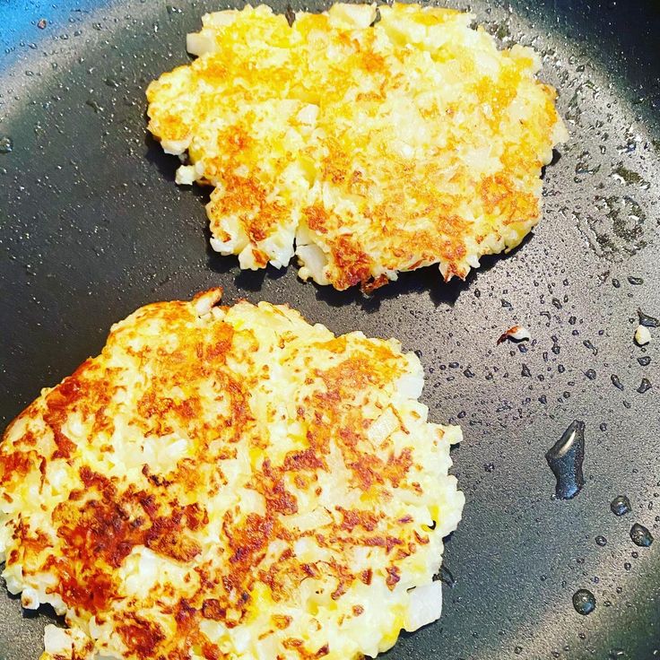 two pieces of food cooking in a frying pan