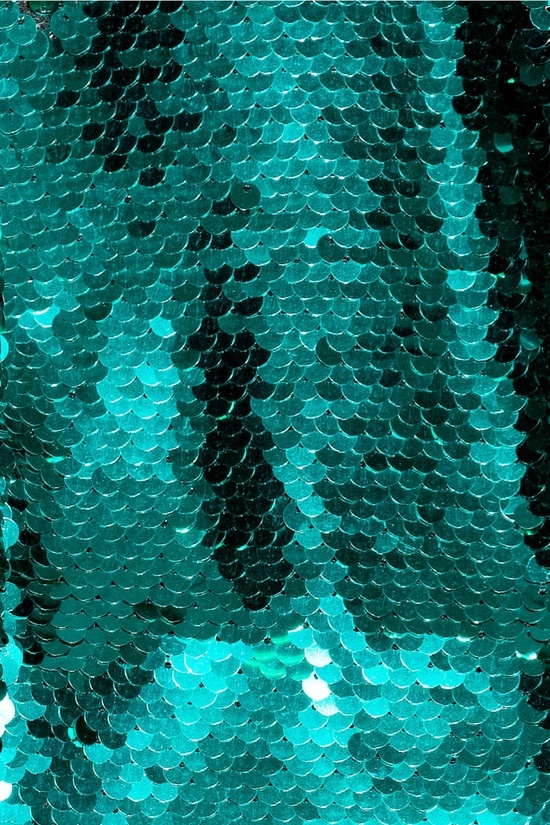 a close up view of the sequins on a green background greeting card by panoramic images