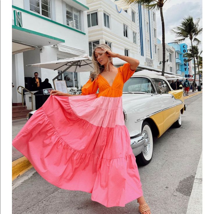 Sunset Skies Dress This Unique And Stunning Maxi Dress Is Just What Your Wardrobe Has Been Missing. It Features An Orange, Pink And Salmon Colored Colorblock Design With A V Neckline, Tiered Skirt And Short Puff Sleeves. It Also Has Pockets! Perfect For Your Next Special Occasion Or Dat Spring Vacation Color Block Dresses, Summer Orange Color Block Dresses, Spring Beach Color Block Maxi Dress, Summer Bohemian Color Block Dresses, Bohemian Color Block Summer Dress, Spring V-neck Color Block Maxi Dress, Summer Beach Color Block Maxi Dress, Spring Color Block V-neck Maxi Dress, Color Block Maxi Dress For Vacation