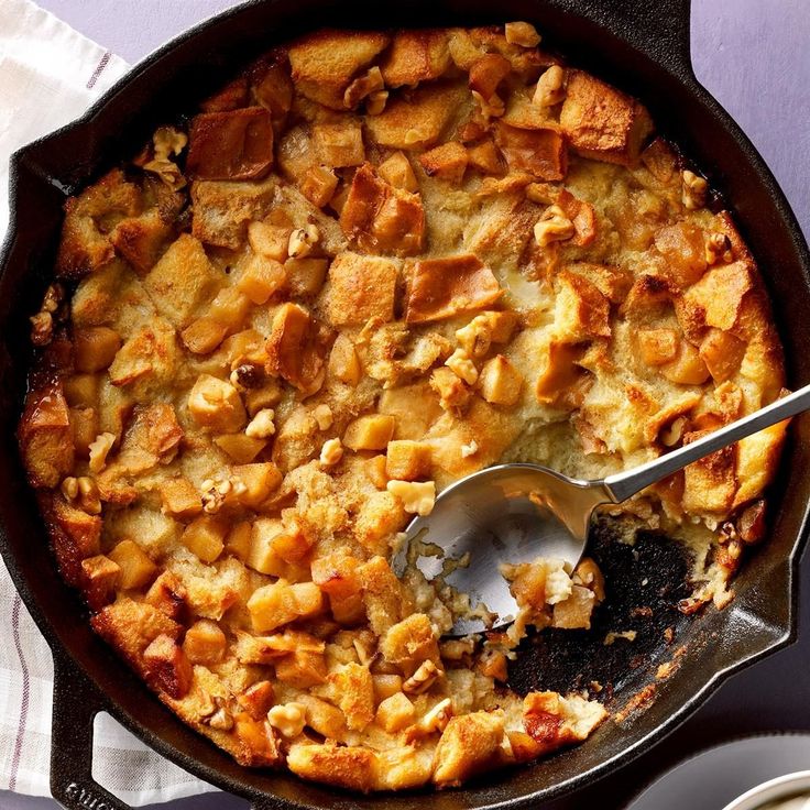 a casserole dish is shown with a spoon in it and on the side