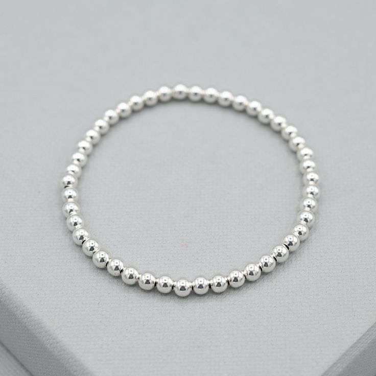 4mm Sterling Silver Bracelet - Jewel Ya Classic Silver Charm Bracelet For Everyday, Classic Charm Bracelet With Sterling Silver Clasp For Everyday, Simple Adjustable Sterling Silver Bracelet, Silver Minimalist Stretch Bracelet As Gift, Everyday Classic Charm Bracelet With Sterling Silver Clasp, Silver Jubilee Stretch Bracelet For Everyday, Modern Silver Beaded Bracelets For Everyday, Minimalist Silver Beaded Bracelets, Simple Hypoallergenic Sterling Silver Bracelets