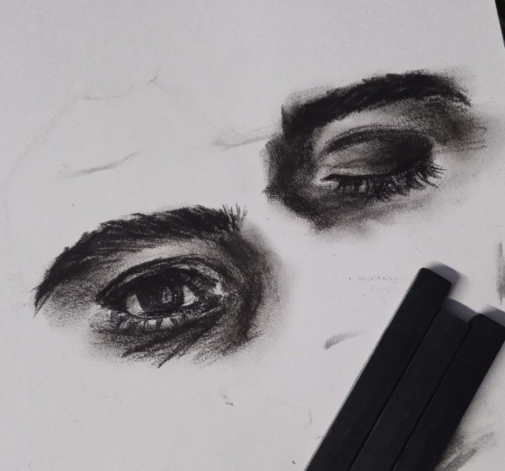 a pencil drawing of an eye and eyebrows