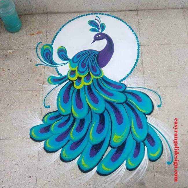 a peacock painted on the ground with blue and green feathers