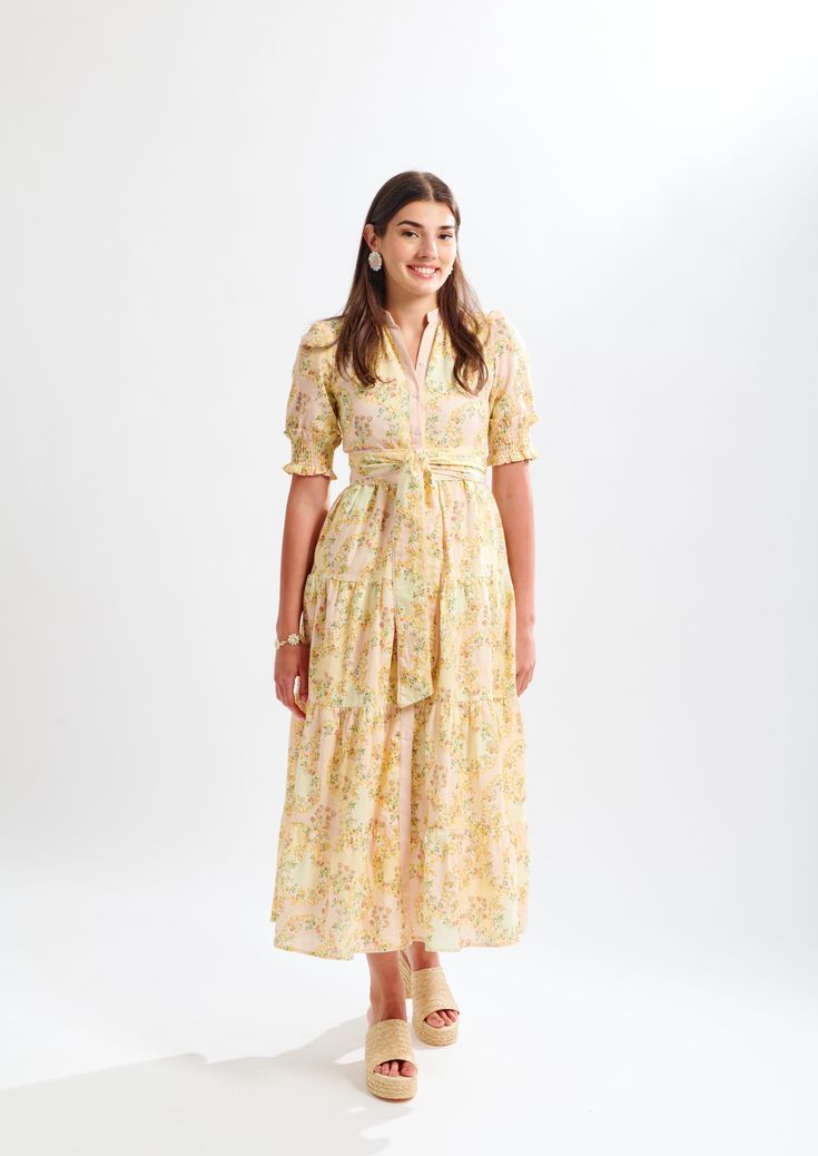 Introducing Lola, a timeless silhouette in an all-new pattern. A baroque-inspired print with shades of ballet pink, gold, and sunshine yellow. Admire the intricate detail of the handpainted wildflowers in the design file. Ideal for dressier occasions such as Sunday brunch, high tea, or a summer soirée. Elegant Yellow Floral Dress For Garden Party, Feminine Yellow Midi Dress For Daywear, Gold Spring Daywear Dresses, Gold Dress For Spring Daywear, Spring Gold Floral Print Midi Dress, Spring Gold Midi Dress With Floral Print, Spring Floral Print Gold Dresses, Feminine Yellow Floral Dress For Garden Party, Summer Soiree