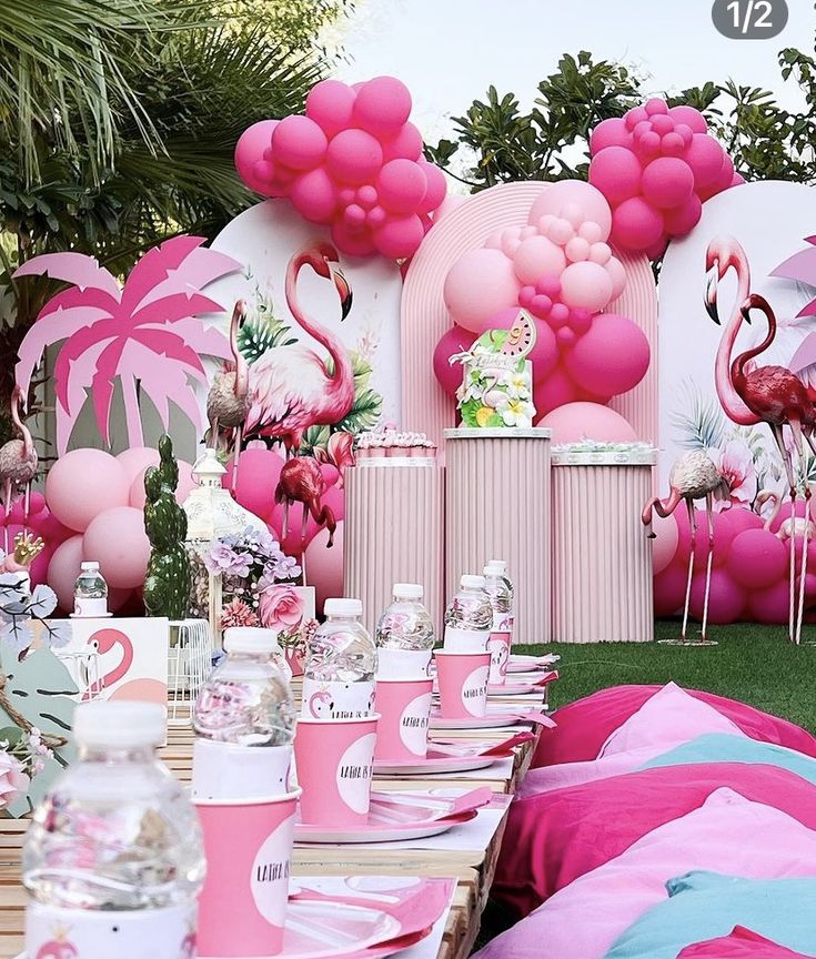 pink flamingo themed birthday party with balloons and decorations