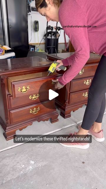 a woman in pink shirt sanding drawers on top of a wooden dresser with an open drawer