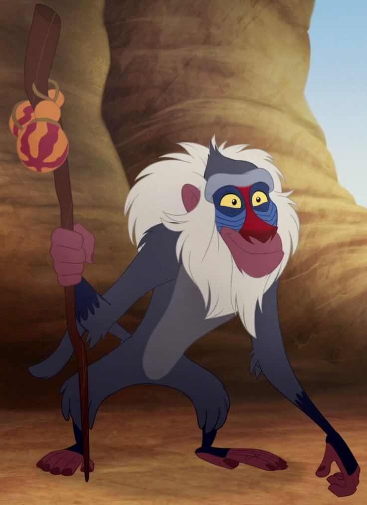 an animated monkey holding a stick in front of a desert scene with rocks and mountains