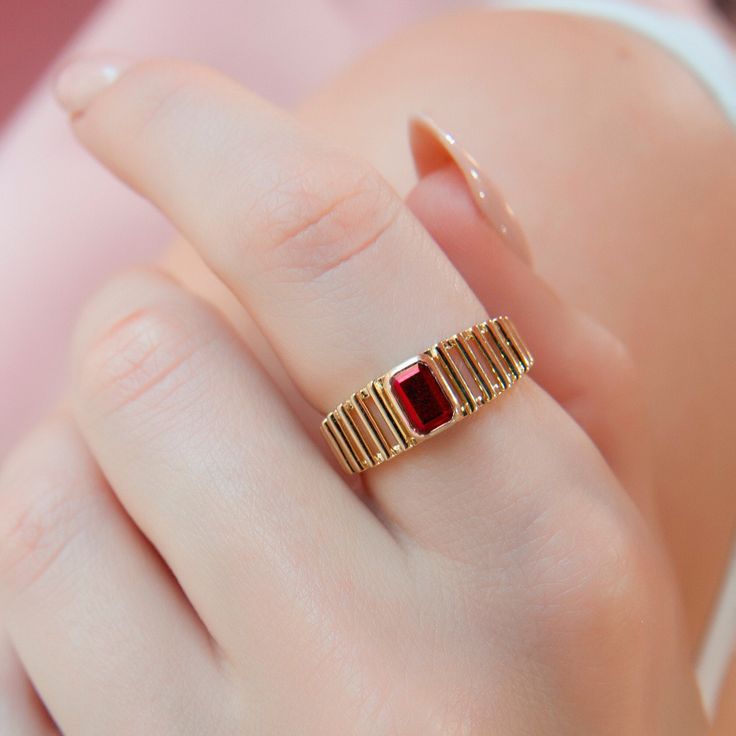 This stunning gold ring features a rectangular red Ruby gemstone set in a unique band design. A perfect blend of elegance and modern style, ideal for special occasions or daily wear. ❤️ All products are made with love, labor and care. They bring you the best wishes. 🎁 All products are sent in special packages.  👋 You can write to us for any question you have in mind. Questions, comments, or just want to say hi? 💎 All products are made by experienced craftsmen. 🛒 Ready to Ship in 2-3 Business Classic Rectangular Ruby Ring In Gold, Gold Rectangular Ruby Ring, Rectangular Gold Ruby Ring For Gift, Red Ruby Ring With Rectangular Stone For Gift, Rectangular Red Ruby Ring Gift, 14k Gold Ruby Ring, Ruby Wedding Rings, Ruby Ring Gold, Unique Bands