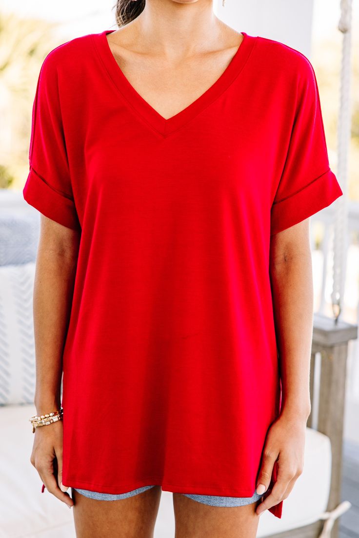 This versatile v-neck tee is here to make your life easy! It's honestly the perfect top for year round styling and layering. You can knot the hem or half tuck into your favorite jeans or shorts. You can layer it with all sorts of jackets, shackets, or kimonos. And don't even get us started on accessories! The options are absolutely endless! This top is truly a staple piece! This top features a v neckline, short cuffed sleeves, and a generous fit.Material has generous amount of stretch. Sydney is Red T-shirt For Summer Loungewear, Solid Color V-neck T-shirt For Day Out, Solid V-neck T-shirt For Day Out, V-neck T-shirt For Day Out, Red Relaxed Fit V-neck T-shirt, Red V-neck Top For Day Out, Red V-neck Top, Mint Julep Boutique, Mint Julep