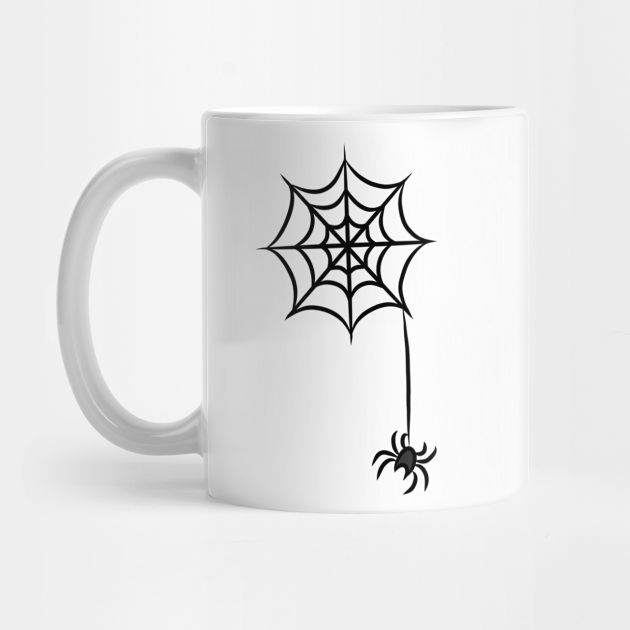 a white coffee mug with a spider web on it