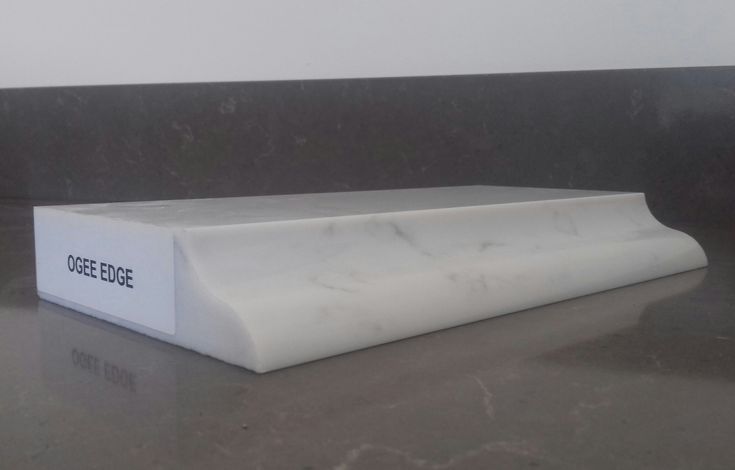 a white box sitting on top of a counter next to a black and white wall