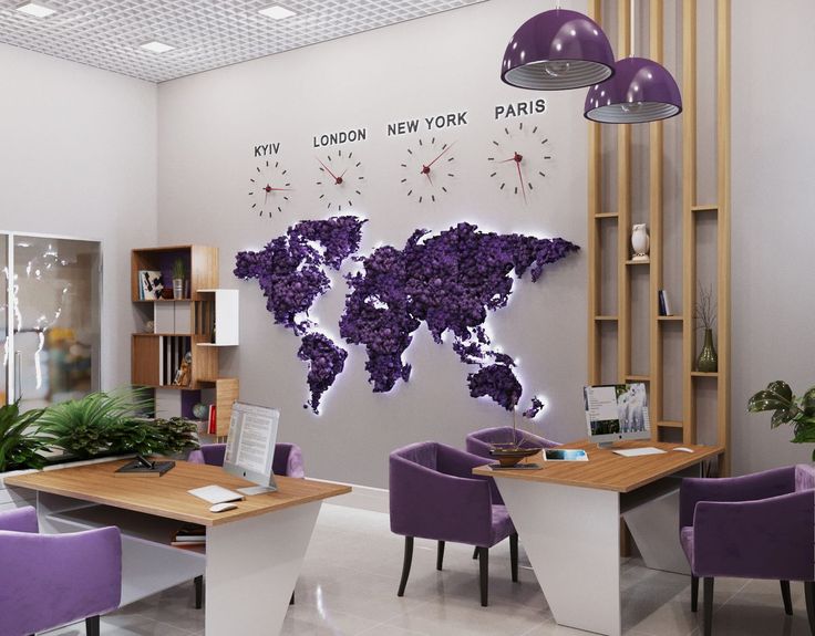 an office with purple chairs and a large world map on the wall above it's desks