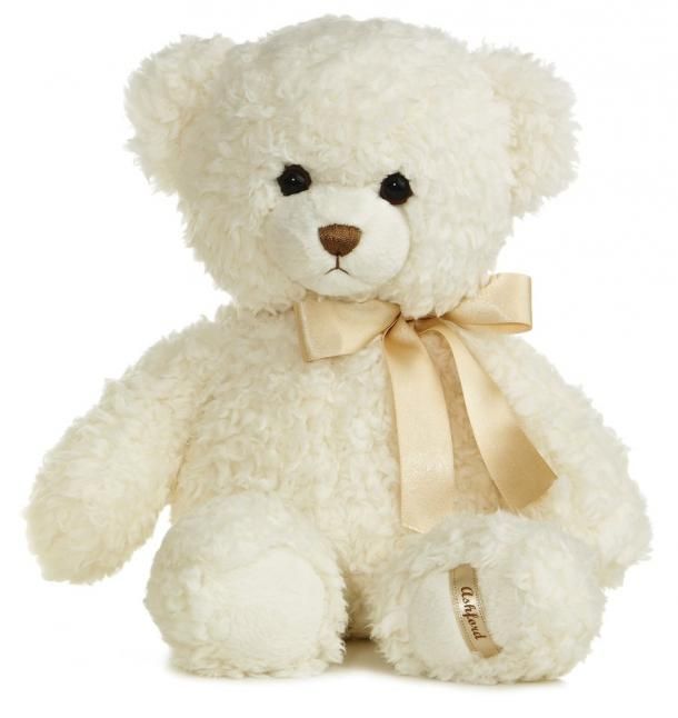 a white teddy bear with a bow on it's neck and eyes, sitting in front of a white background