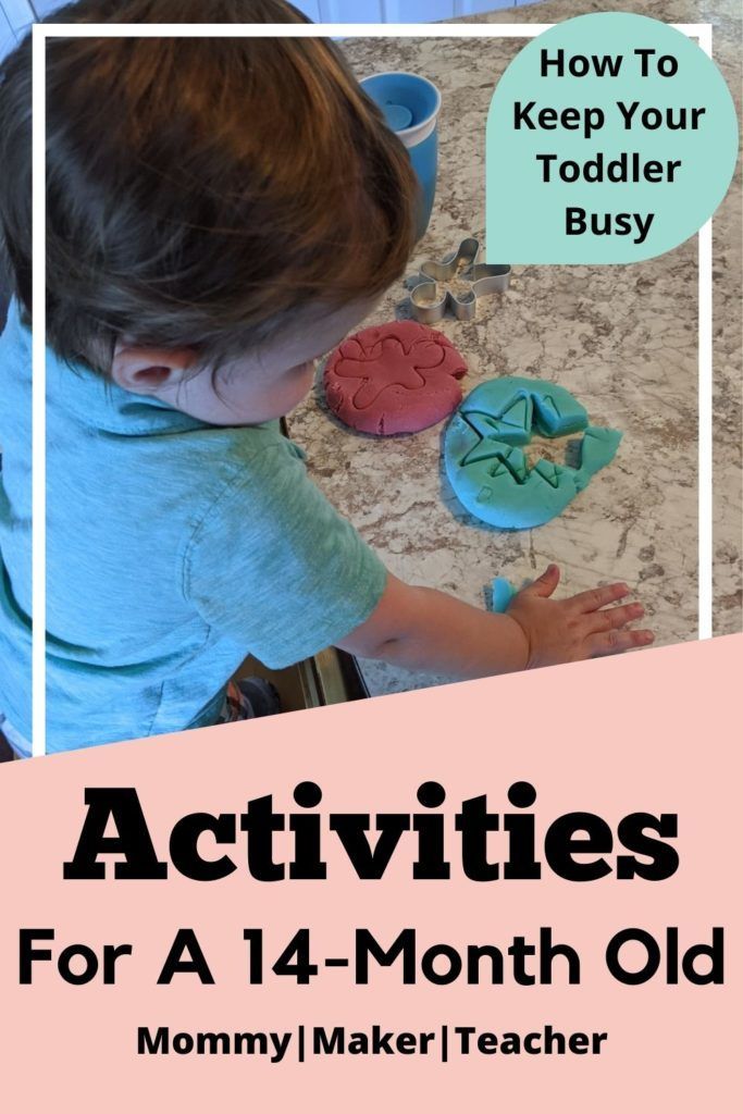 a young child is playing with some cookies