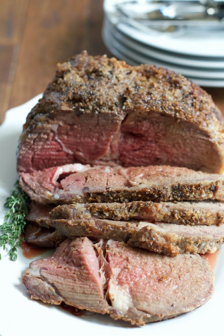 a large piece of meat sitting on top of a white plate