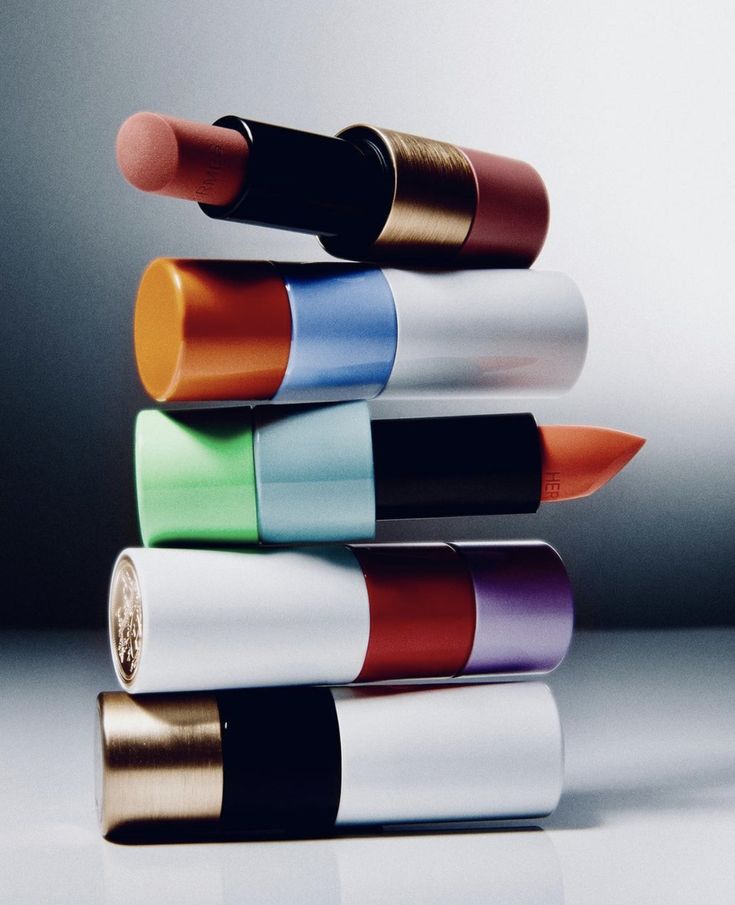 a stack of different colored lipsticks sitting on top of each other