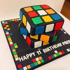 a birthday cake made to look like a rubik cube