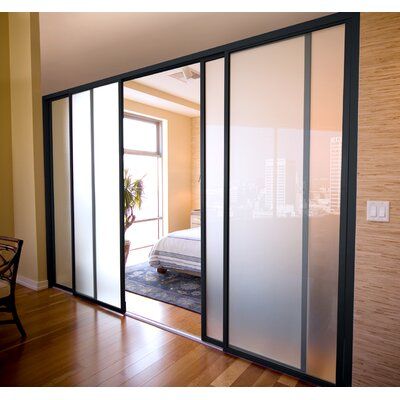 the sliding glass doors are open and ready to be used as a bedroom divider