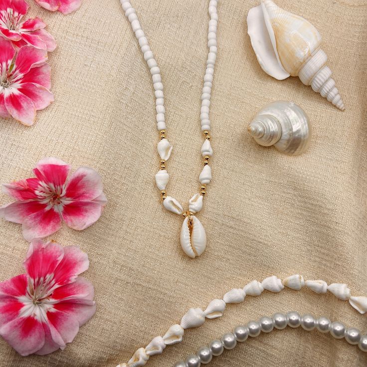 White Glass Seed Bead Necklace With Beaded Conch Shells And Bohemian Cowrie Shell Pendant - High quality 24K Gold - Adjustable Looks so dainty and bohemian, the perfect piece this summer Length: 36cm + 5cm extender chain Made from high quality 24K gold to ensure long lasting colour and durability  🌸 One of a kind, handmade  item 🌸 ✨ Comes in beautiful gift packaging ✨ Perfect Gift - Birthday Valentines day Christmas Mother's Day Anniversary gift set 📬 We ship worldwide ✨ Don't forget to follo Cheap White Shell Necklaces, Cheap White Beaded Shell Necklace, Summer Beads, Glass Seed Bead Necklace, Conch Shells, Conch Shell, Shell Jewelry, Cowrie Shell, Seed Bead Necklace