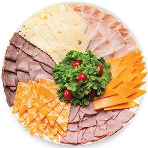 an assortment of cheeses and meats on a plate