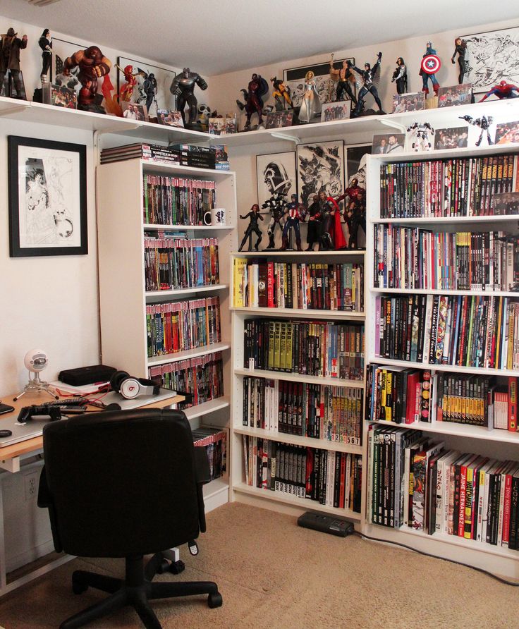 a room filled with lots of books and toys on top of white shelving units