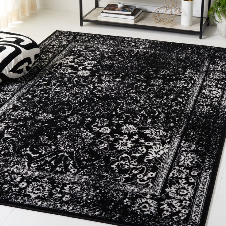 a black and white rug in a living room