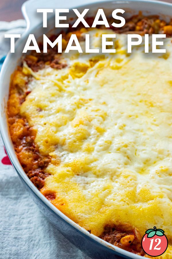 a casserole dish with cheese on top and the words texas tamale pie above it