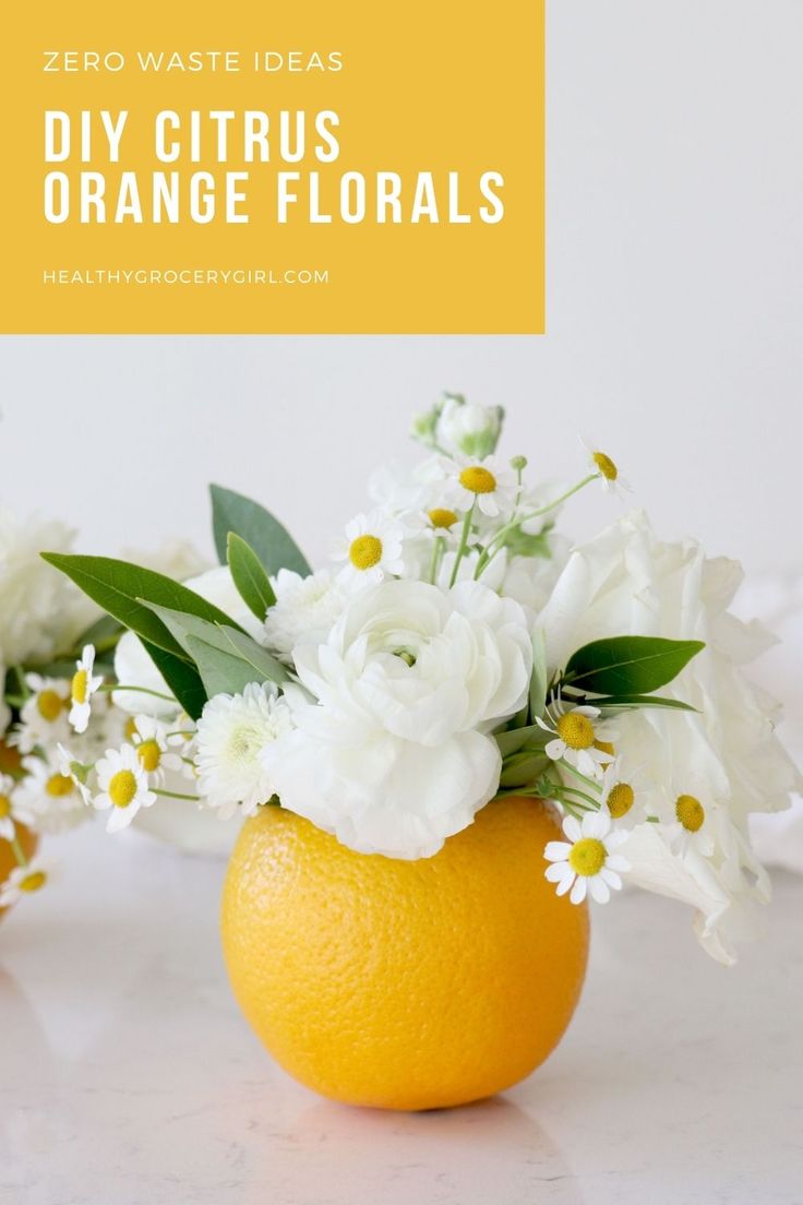 an orange with white flowers in it and the words zero waste ideas diy citrus orange florals