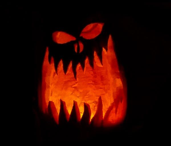 a pumpkin carved to look like a monster's mouth