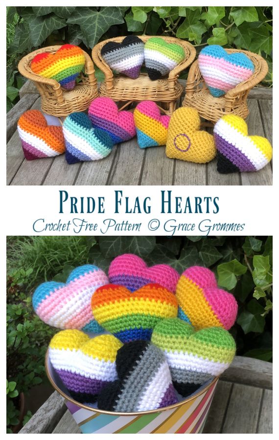 crocheted pride flag hearts are sitting on a table next to a basket full of rainbows