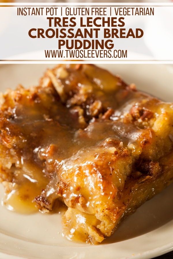 a white plate topped with two pieces of cake covered in caramel sauce next to a fork