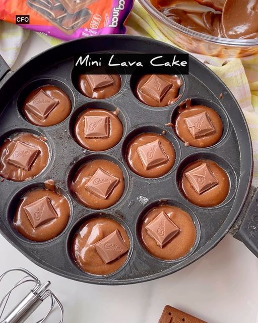 a pan filled with chocolates sitting on top of a counter next to other ingredients