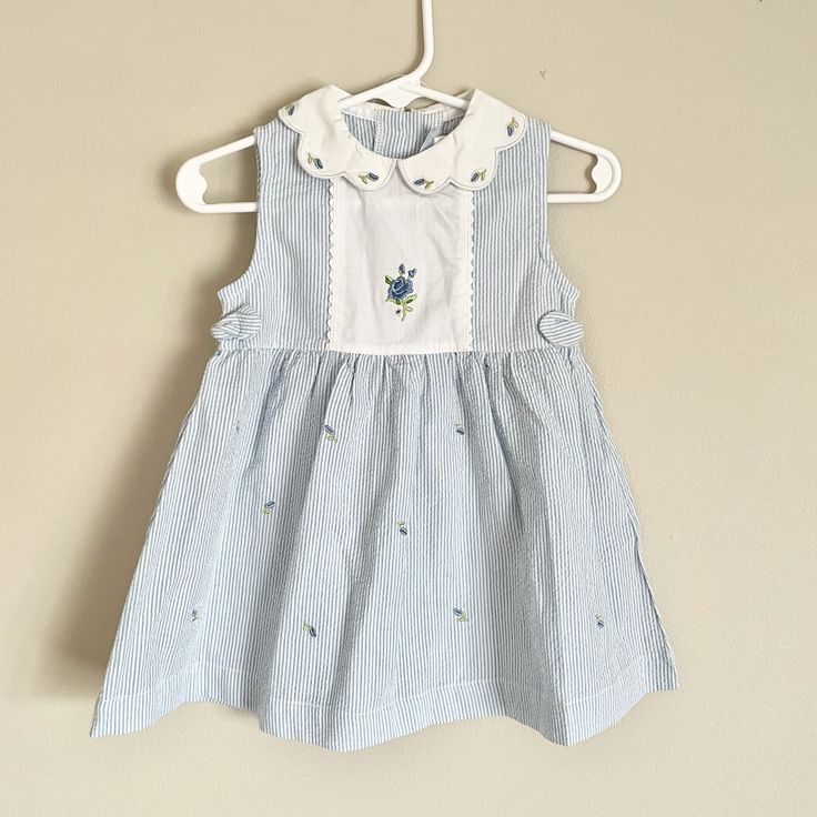 Beautiful Blue And White Spring Dress Blue Fitted Sleeveless Dress For Dress-up, Spring Light Blue Cotton Sleeveless Dress, Blue Cotton Sleeveless Dress For Spring, Light Blue Cotton Sleeveless Dress For Spring, Sleeveless Sundress For Playtime, Light Blue Sleeveless Dress For Dress-up Occasions, Cotton Sleeveless Sundress For Babies, Blue Cotton Sleeveless Dress With Ruffles, Sleeveless Sundress For Spring Playdate