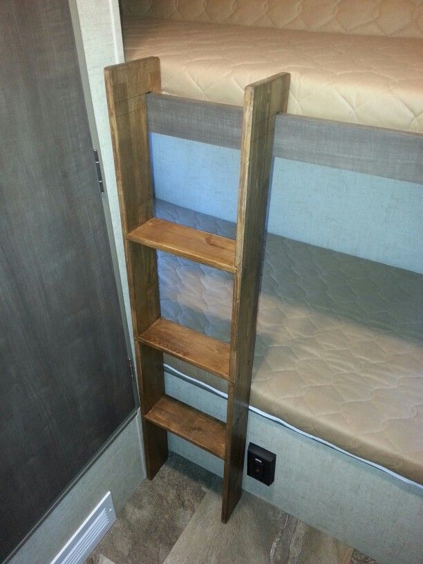 there is a bunk bed in the room with no mattresses or sheets on it