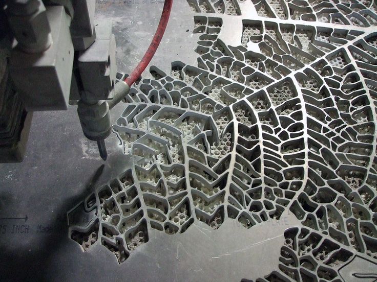 an image of a machine that is working on some kind of pattern in the ground