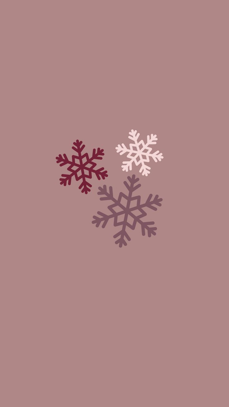 two snowflakes on a pink background, one is red and the other is white