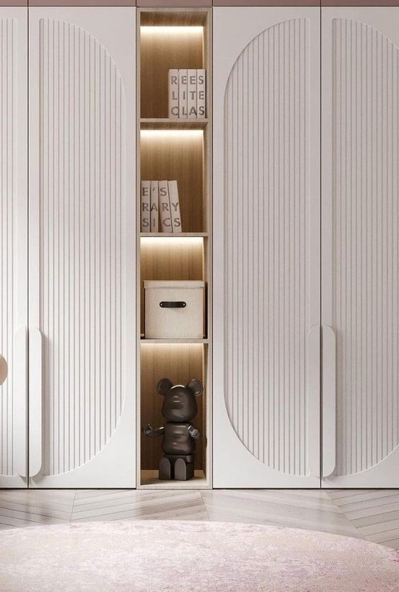 a white closet with two doors and shelves