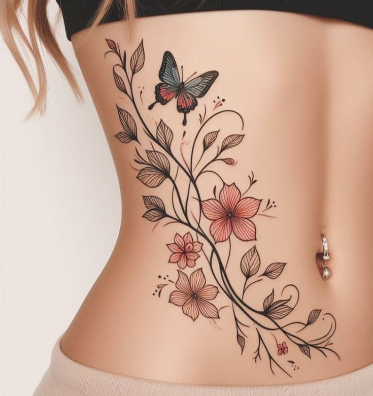 a woman's stomach with flowers and butterflies on it