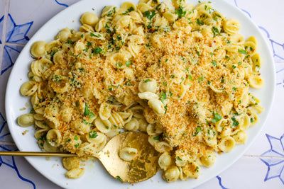 a white plate topped with macaroni and cheese