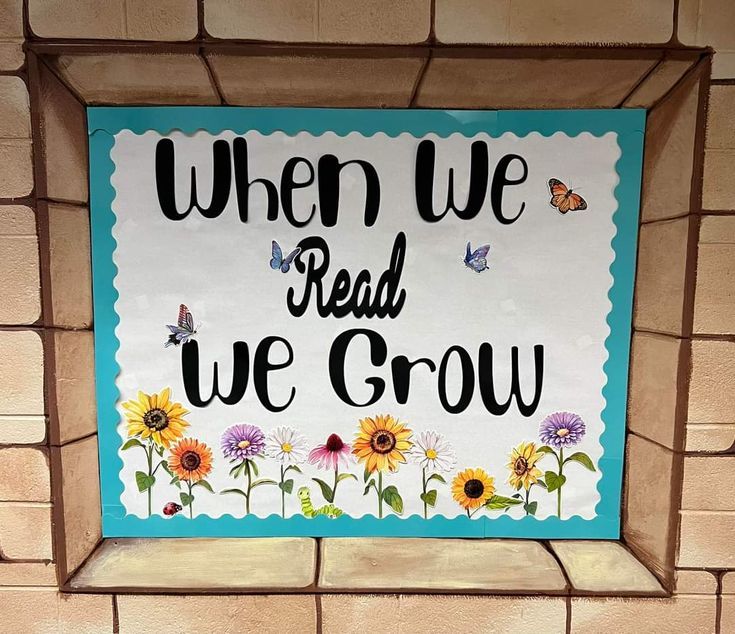 a sign that says, when we read we grow with sunflowers and butterflies