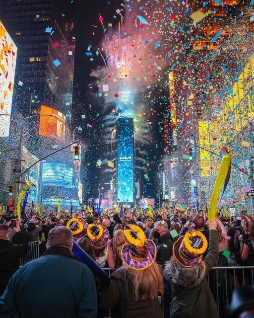 people are celebrating in times square with confetti and streamers