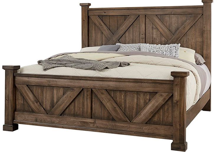 a bed with wooden headboard and foot board on top of it, against a white background