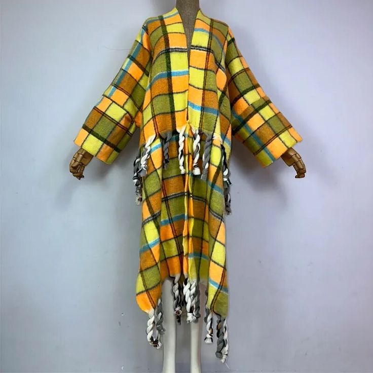 This super soft and warm wool cardigan kimono is perfect for the cold weather. Unlike other sweaters and wools, the wool used for this beauty is non itchy. Think of your favorite throw blanket, the comfort and warmth it gives but 10x stylish and wearable any where. This kimono is all that and more! One size fits S-4X Material: Wool One Size Fits Most Size Chart Oversized Shawl Cardigan For Winter, Yellow Sweater For Winter Loungewear, Yellow Winter Sweater For Loungewear, Yellow Winter Loungewear Sweater, Oversized Plaid Cardigan For Winter, Winter Shawl Cardigan For Layering, Cozy Multicolor Sweater Coat For Fall, Oversized Plaid Winter Cardigan, Multicolor Warm Outerwear For Fall