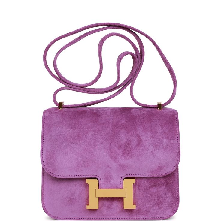 This Constance is in Violet doblis leather with gold hardware and has tonal stitching, a metal "H" snap lock closure and adjustable shoulder strap.The interior is lined with Violet lambskin and has an open pocket on the front wall, a center divide, and a slit pocket on the back wall. Collection: ZOrigin: FranceCondition: Pristine; new or never worn (plastic on hardware)Accompanied by: Hermes box, Hermes dustbag, felt and carebook Measurements: 7.25" width x 6.25" height x 2.25" depth; 20" adjust Snap Lock, Hermes Constance, Hermes Box, Hermes Bags, Luxury Handbags, Gold Hardware, New Bag, Luxury Bags, Dust Bag