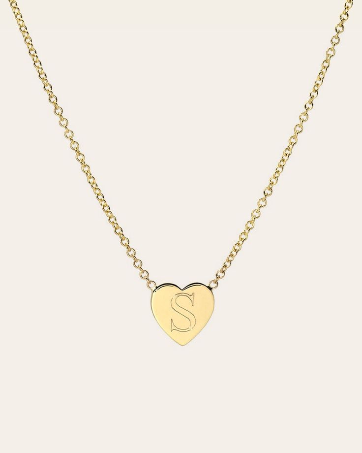 14k solid gold engraved single letter on our dainty heart hanging from a cable link chain in the length of your choice. Wear by itself or layered, this necklace is timeless and a classic! Size of Heart: Approx. 6mm(W) by 6mm(H) Total Weight: Approx. 1 gram Standard Production: 5-10 business days Rush Order Production: 4-6 business days Shipping: Select shipping method at checkout. Shipped from our L.A. Studio. This item is Final Sale. See here for details. Dainty Everyday Name Necklace With Heart Pendant, Dainty Personalized Heart Necklace With Initial Pendant, Personalized Heart Pendant Initial Necklace For Everyday, Dainty Heart Pendant Name Necklace For Everyday, Classic Charm Necklace With Heart Pendant And Adjustable Chain, Dainty Personalized Heart Necklace With Initial, Dainty Personalized Initial Heart Necklace, Classic Heart Necklace With Delicate Chain, 14k Gold Charm Necklace With Heart And Initial Pendant