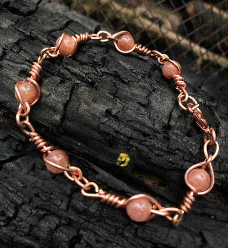 Completely handmade with copper and 5mm Sunstone beads. Each link hand twisted copper. Original design with matching pieces available. 1 of a kind. Copper Wire Jewelry Fire Mountain Gems And Beads, Antique Copper Jewelry, Sunstone Bracelet, Beaded Wrap Bracelets, Handmade Wire Jewelry, Beaded Wraps, Wire Crafts, Wire Art, Copper Jewelry