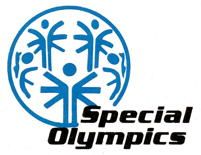 the logo for special olympics is shown in blue and black on a white background with an image of people holding hands