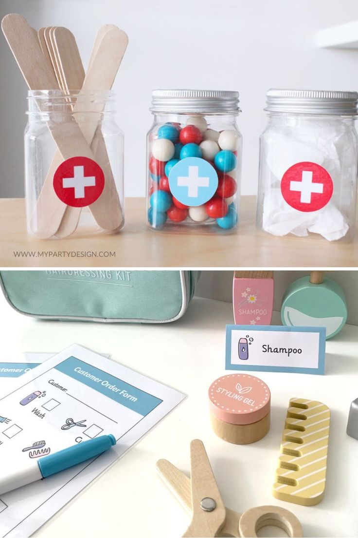 two jars filled with different types of items on top of a table next to scissors