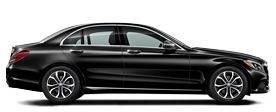 the side view of a black mercedes s - class sedan parked in front of a white background