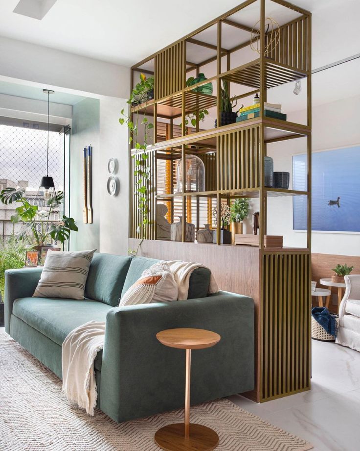 a living room filled with furniture and plants